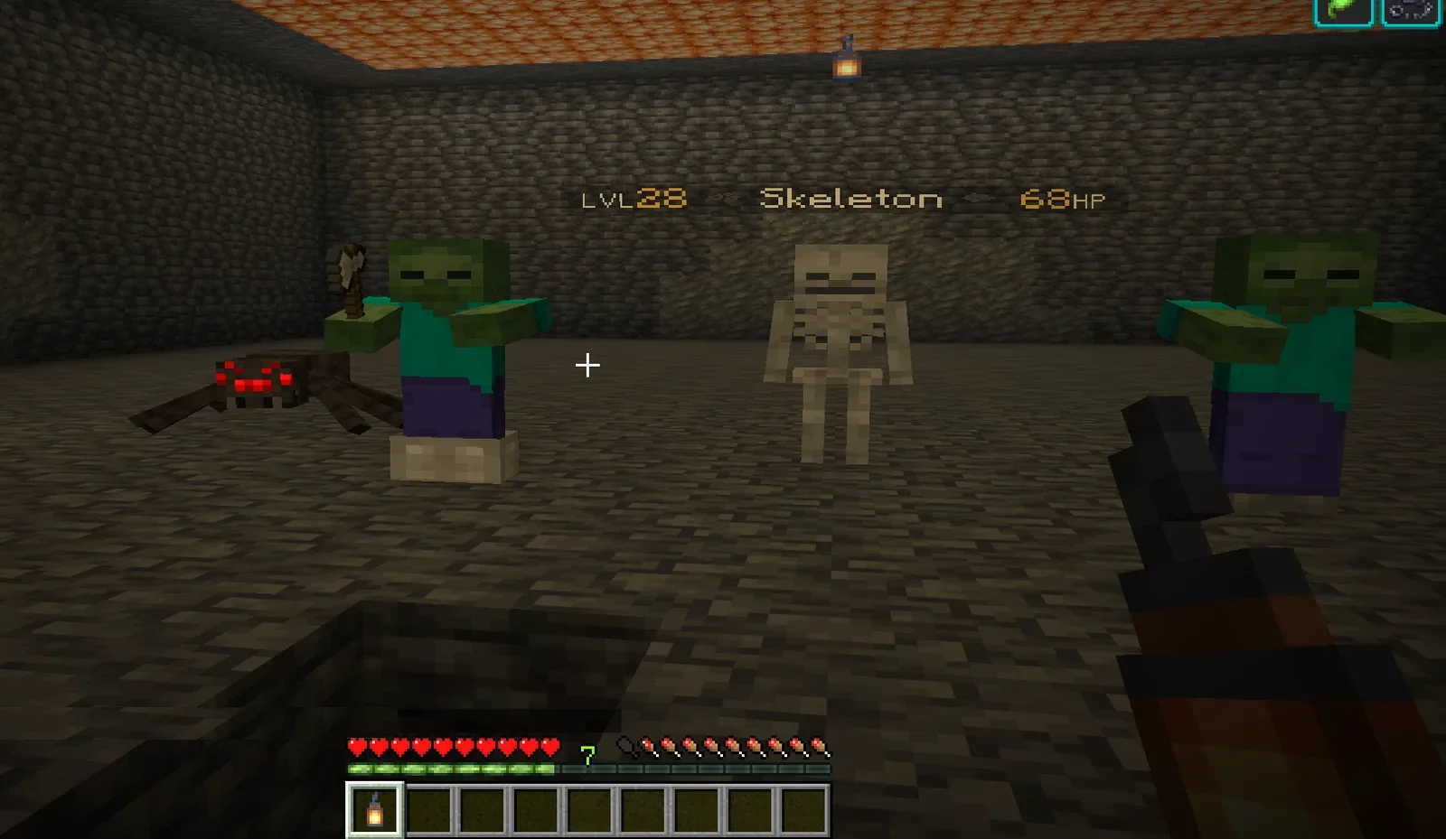 Uno zombie, uno scheletro e un ragno in una caverna; lo scheletro mostra LVL28 Skeleton 68HP