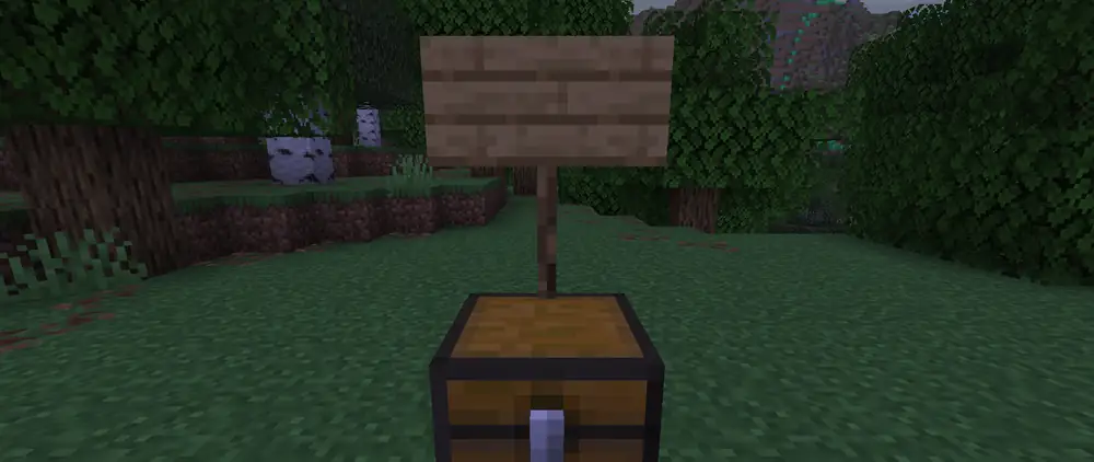 Gods by wmods: a player writes [GOD] and Zeus on a sign over a chest, the sign turns gold and the emerald boundary of the sacred land rises