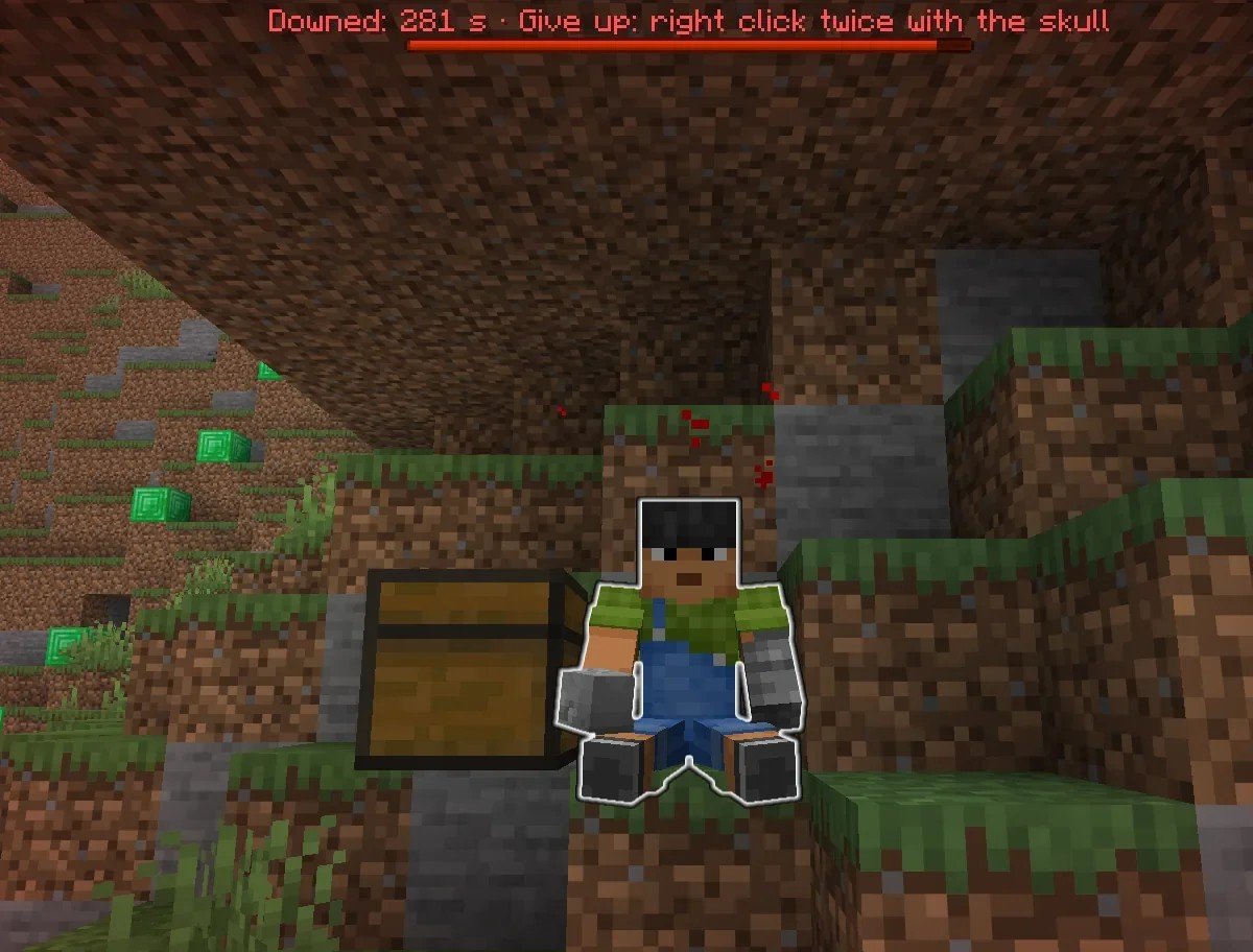 A downed player sitting next to their death chest